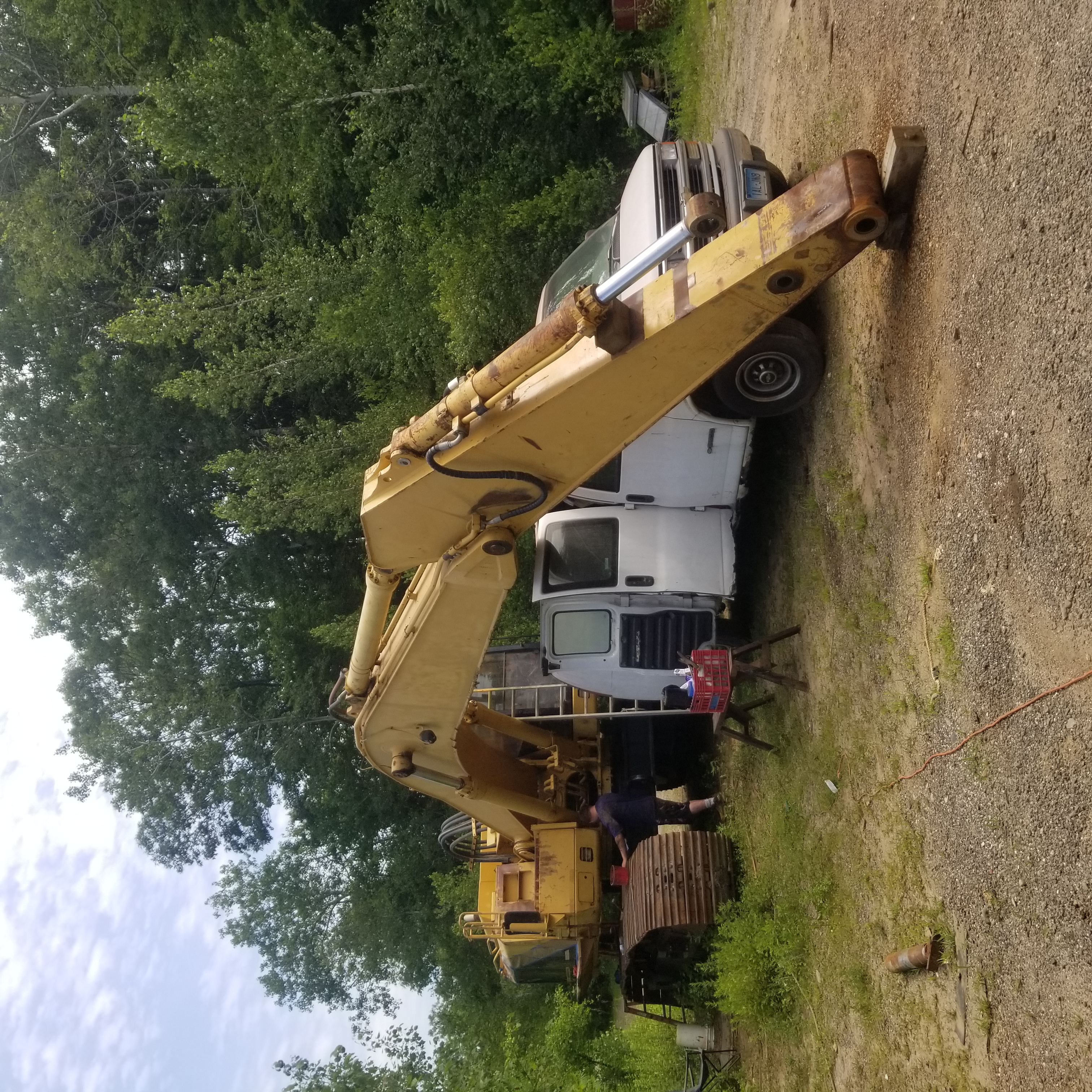 Excavator before paint remediation